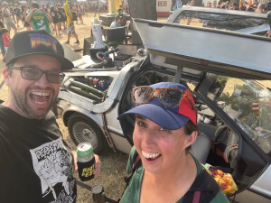 Jamie and Pete in front of a Delorean decked out as a time machine