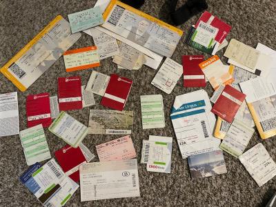 A bunch of plane, public transit, museum and other tickets